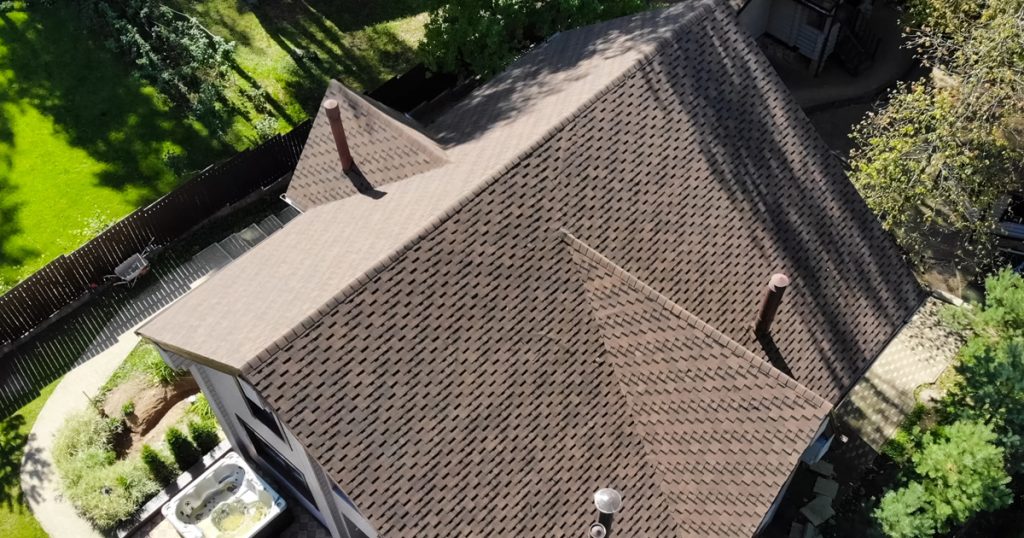 Aerial view of a residential roof in Sarasota after professional roof cleaning and maintenance by Gorilla Kleen