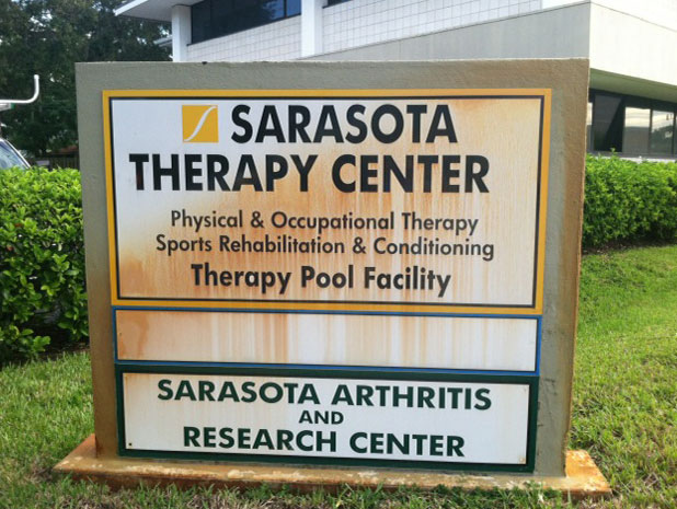 Exterior wall or signage surface before Gorilla Kleen professional pressure washing Sarasota FL