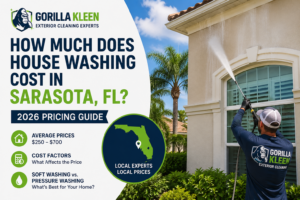 House washing cost in Sarasota FL guide featuring a Gorilla Kleen technician soft washing a residential stucco home in Sarasota, Florida.